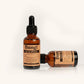 Two bottles of Dang! Ageless serum on a white background