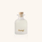 White bottle with cork lid and 'Dang!' branding on a white background