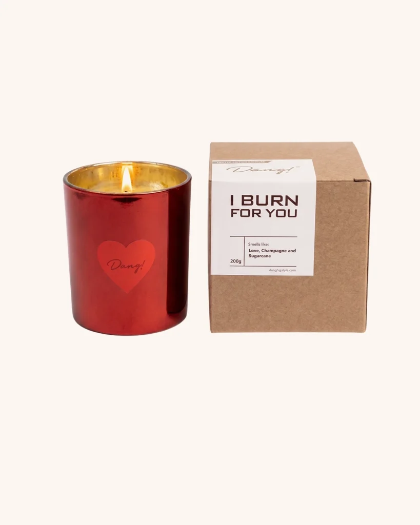 An image of a red-colored scented candle jar