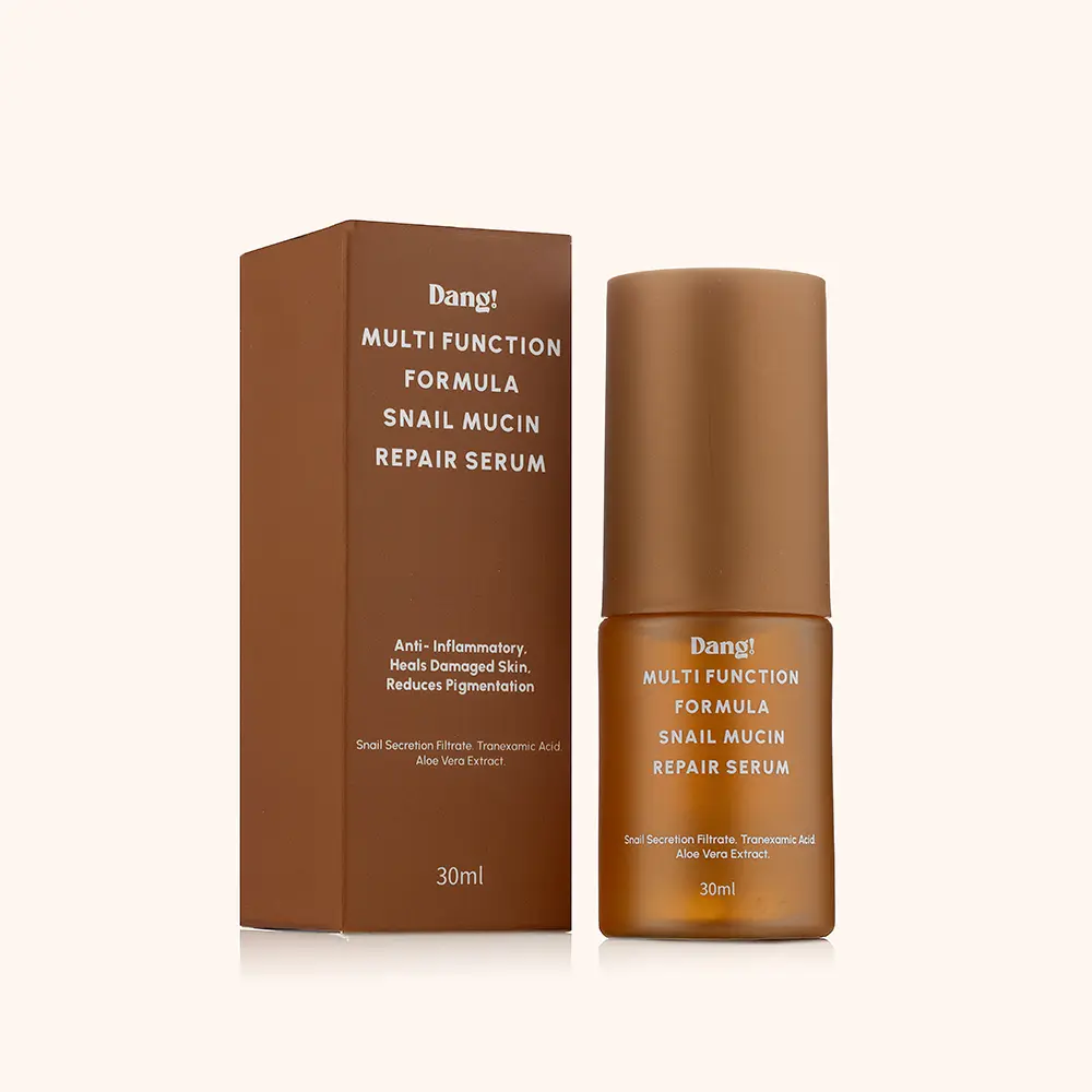 A bottle of snail mucin serum contained inside a brown bottle